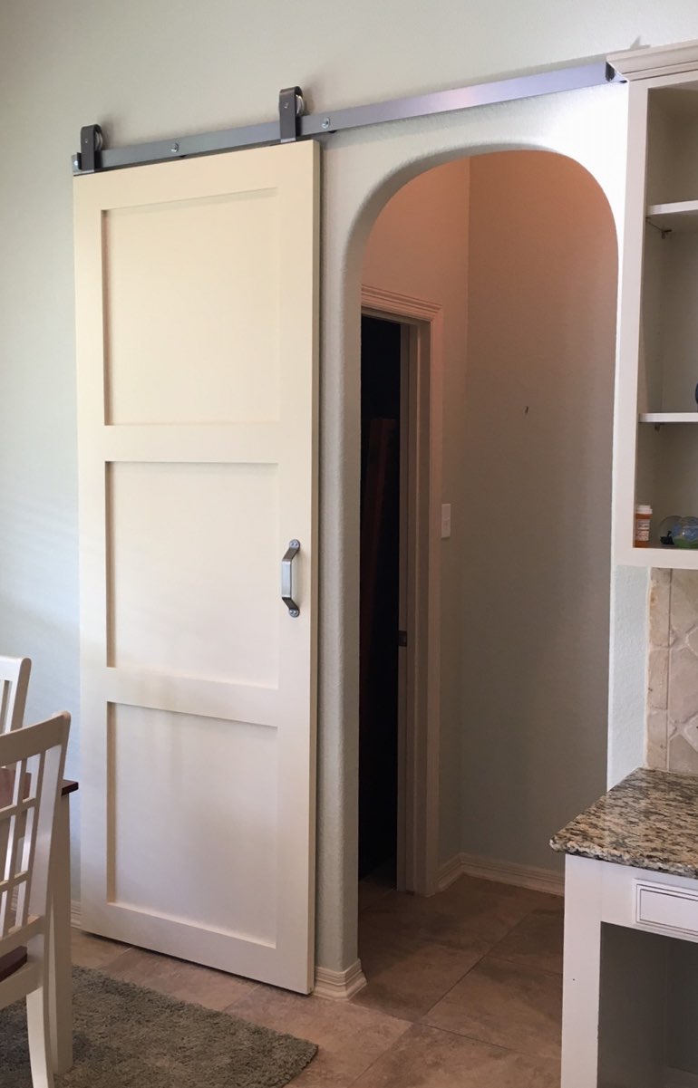 White shaker barn door used for bedroom door 